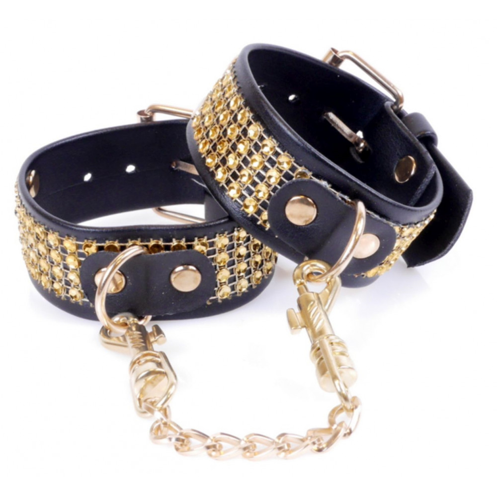 Різне - Наручники зі штучної шкіри з кристалами Fetish Boss Series - Handcuffs with cristals Gold, BS3300095